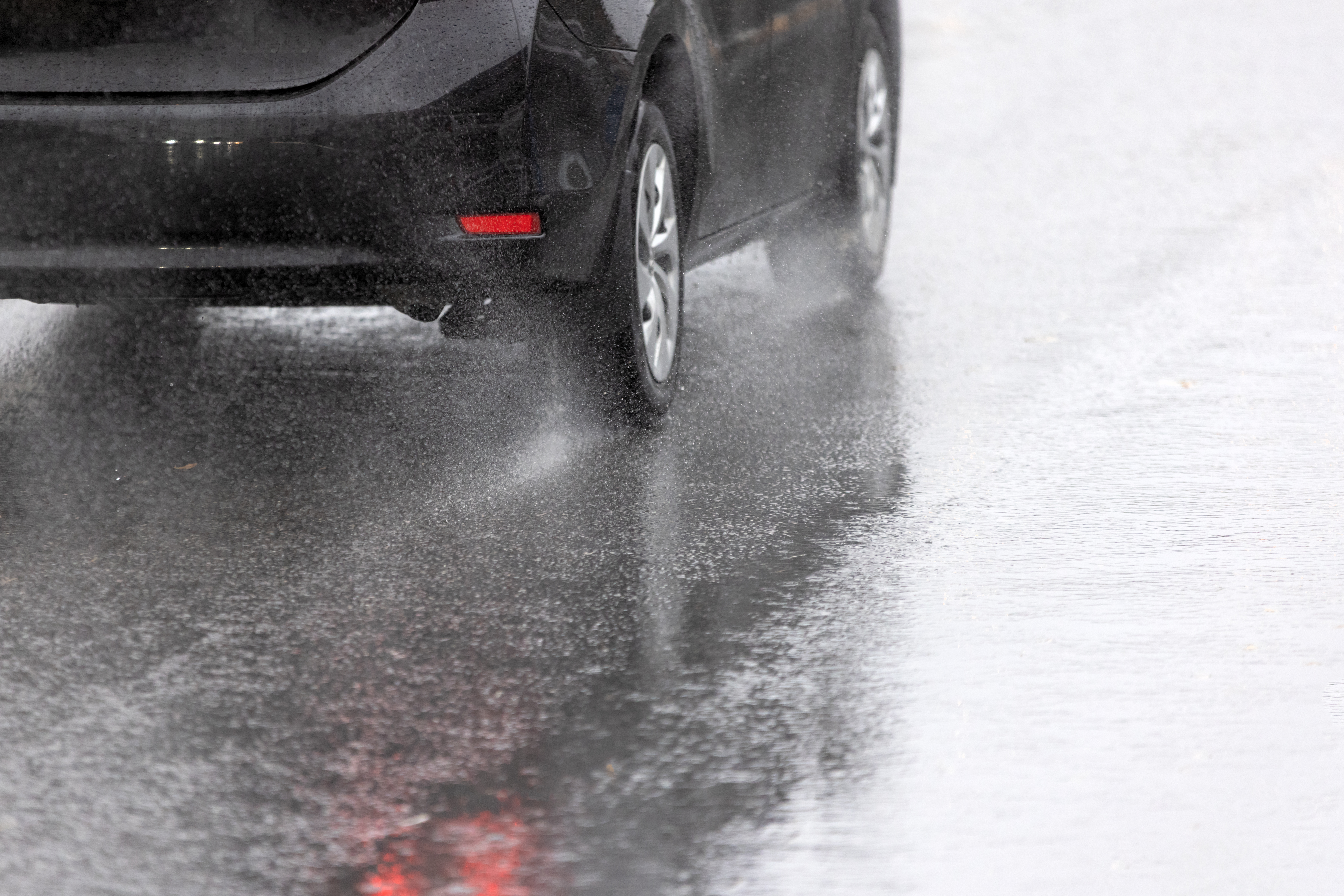 Car driving in the rain